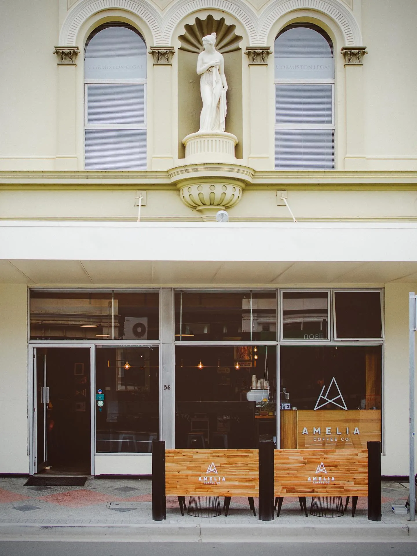 Amelia Coffee Co. storefront on George Street, Launceston — heritage building with outdoor wooden seating